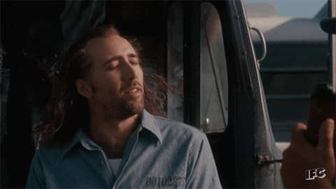 Scene from Con Air where Nic Cage feels the breeze of freedom.