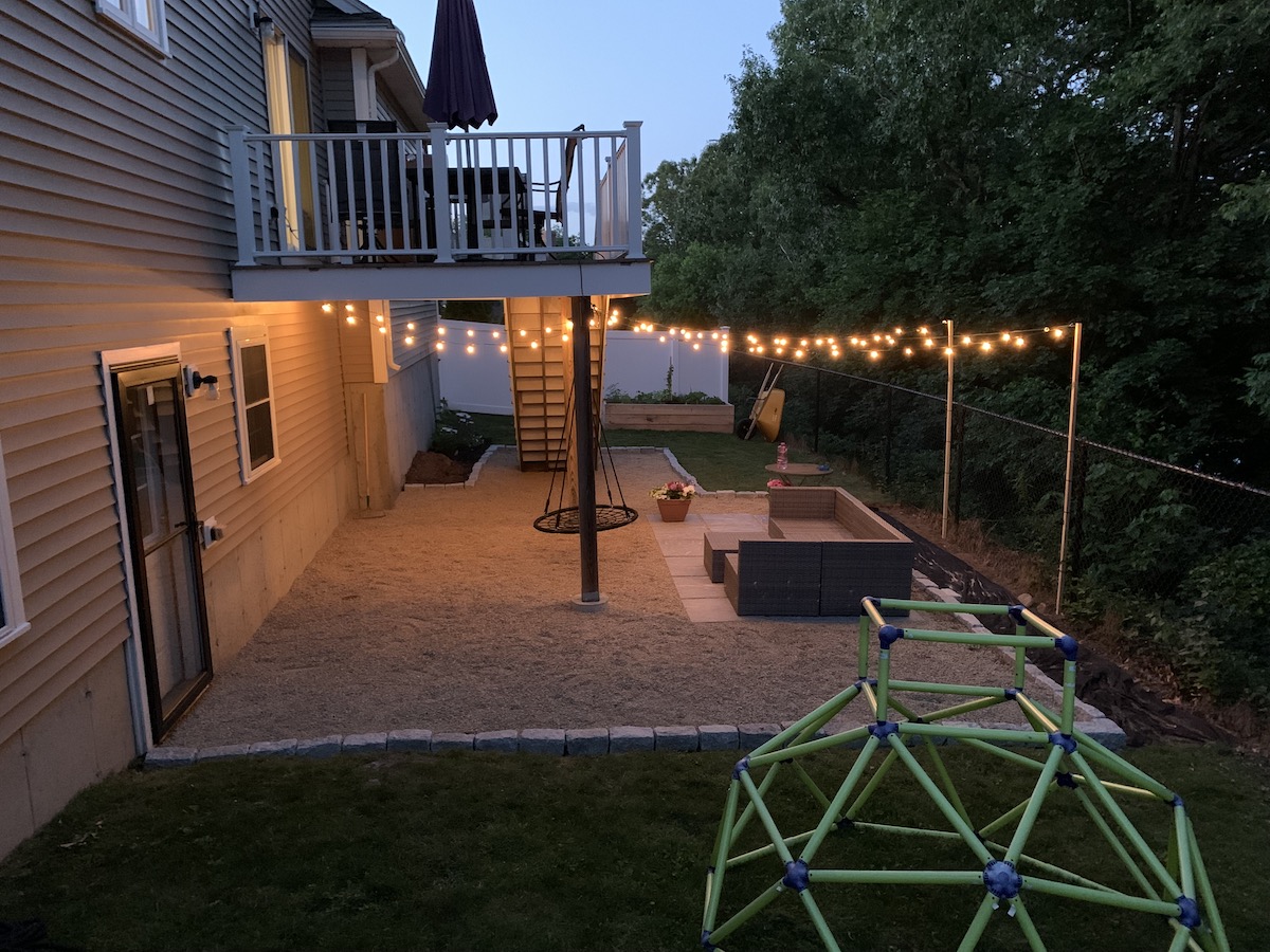 Full photo of the patio in our backyard at night.