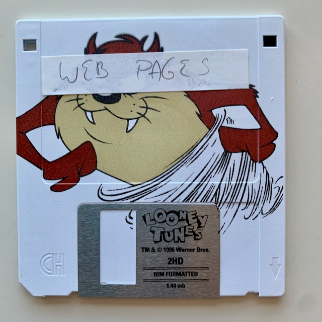 A floppy disk with the Tazmanian Devil on it, with a label over his face which reads "web pages"