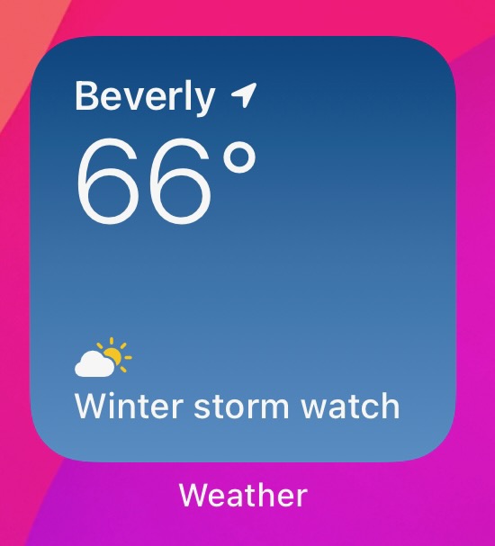Screenshot of the iOS weather app showing a temperature of 66 degrees and a Winter storm warning.